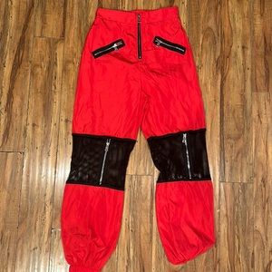 Fun 100% Polyester black & red pants with zippers.